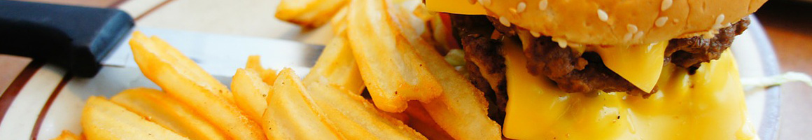 Eating Burger Fish & Chips Seafood at The Crabby Oyster restaurant in Seaside, OR.